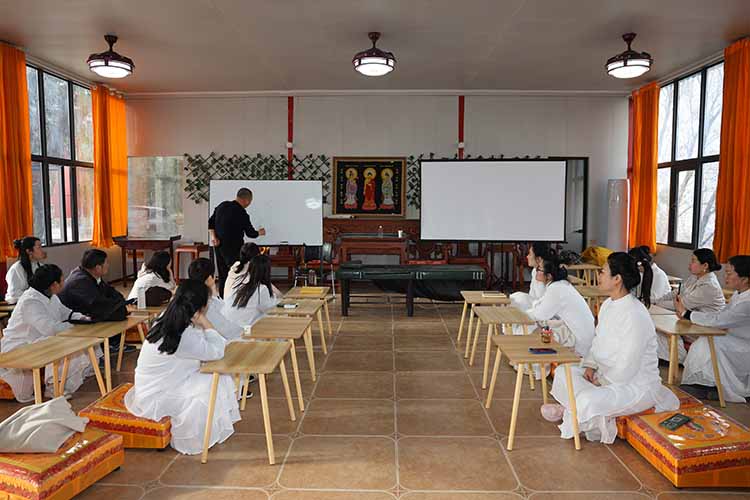 Participants practicing Buddhist Philosophy meditation at Longmen Guanghua Temple in China